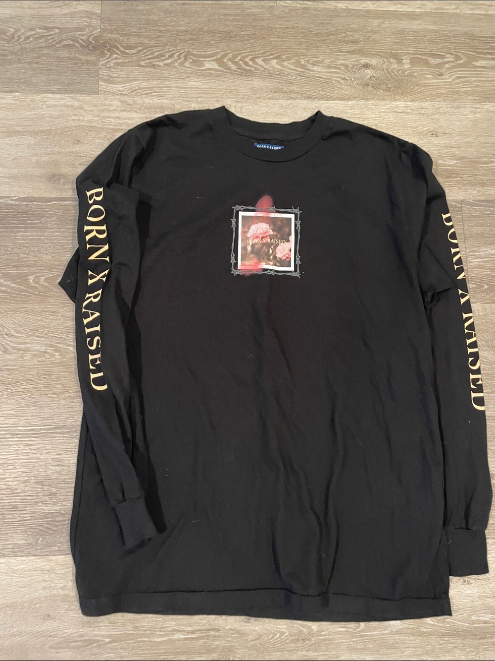 BORN X RAISED Black Long Sleeve Graphic Tee with Gold Sleeve Script